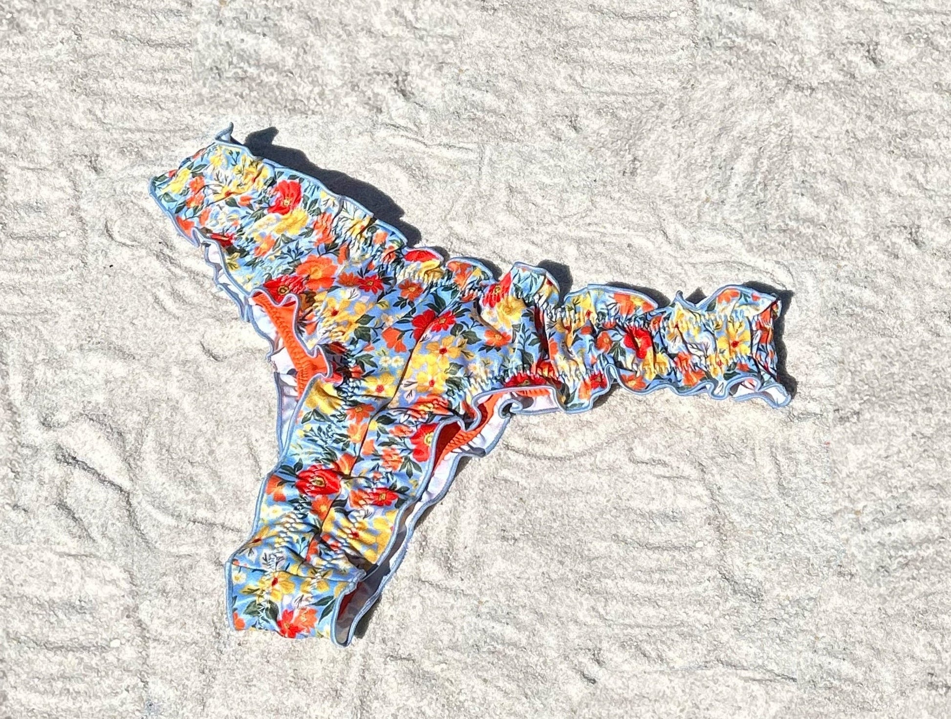 Floral ruffled recycled sustainable bikini bottom lettuce hem thong v waist high cut cheeky medium full coverage