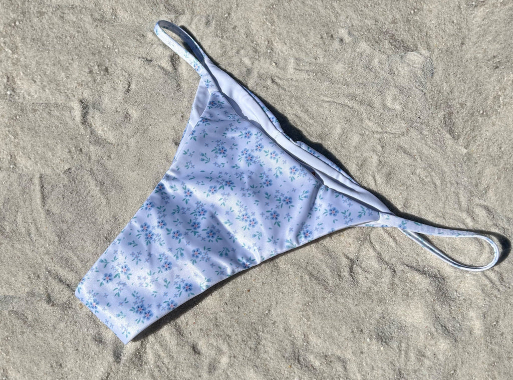White floral ruched string recycled sustainable bikini thong bottom mid rise high cut cheeky medium moderate coverage