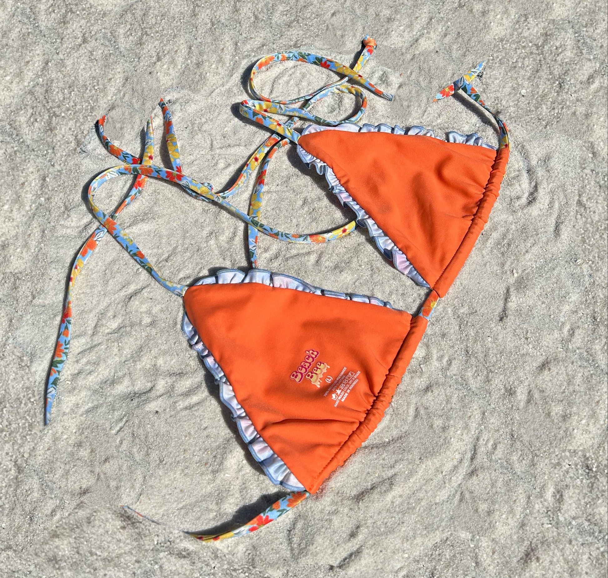 Floral ruffled triangle lettuce hem recycled sustainable adjustable string bikini top