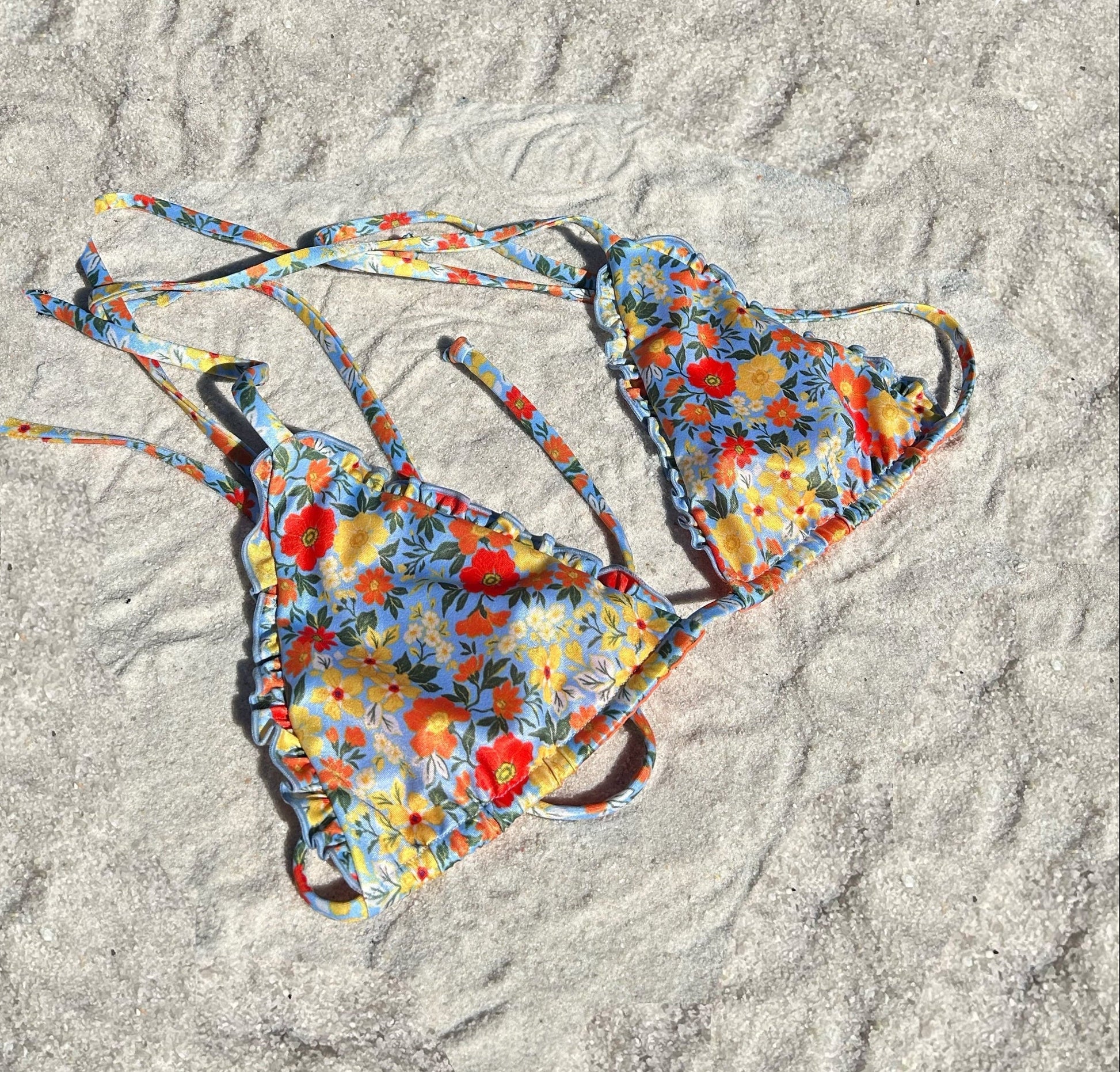 Floral ruffled triangle lettuce hem recycled sustainable adjustable string bikini top